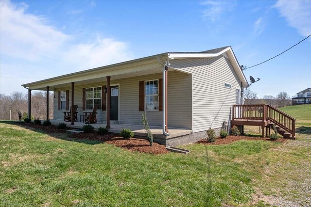 650 Wall Rd, Cunningham, TN 37052 - view of front of property with a front lawn and a porch