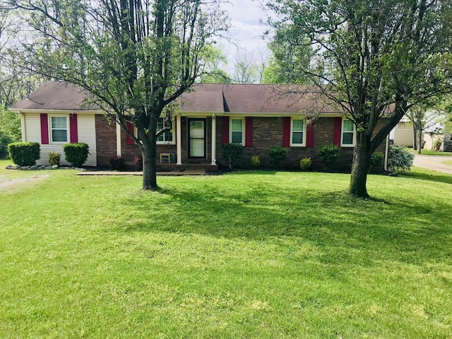 446 Malvin St, Gallatin, TN 37066 - ranch-style house featuring a front lawn and brick siding