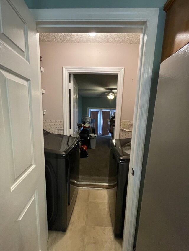 1222 Marla Dr, Clarksville, TN 37042 - washroom featuring washing machine and clothes dryer, ceiling fan, and light tile patterned floors