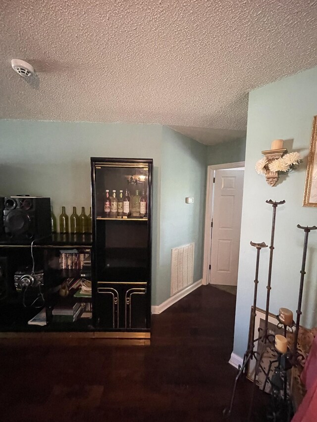 1222 Marla Dr, Clarksville, TN 37042 - hall featuring a textured ceiling, wood finished floors, and baseboards