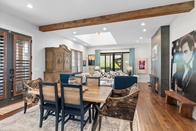 128 37th Ave N, Nashville, TN 37209 - dining space with a skylight, light wood-style flooring, recessed lighting, and beam ceiling