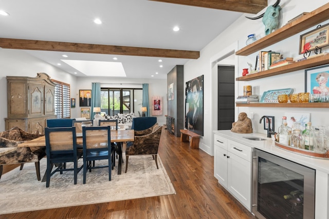 128 37th Ave N, Nashville, TN 37209 - dining room with a dry bar, dark wood finished floors, beam ceiling, wine cooler, and recessed lighting