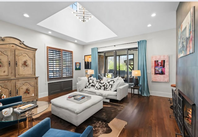 128 37th Ave N, Nashville, TN 37209 - living room with baseboards, a lit fireplace, recessed lighting, and wood finished floors