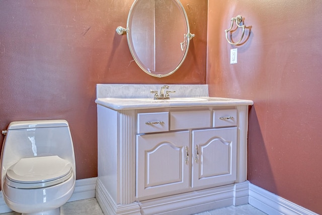 half bath with baseboards, toilet, tile patterned floors, and vanity