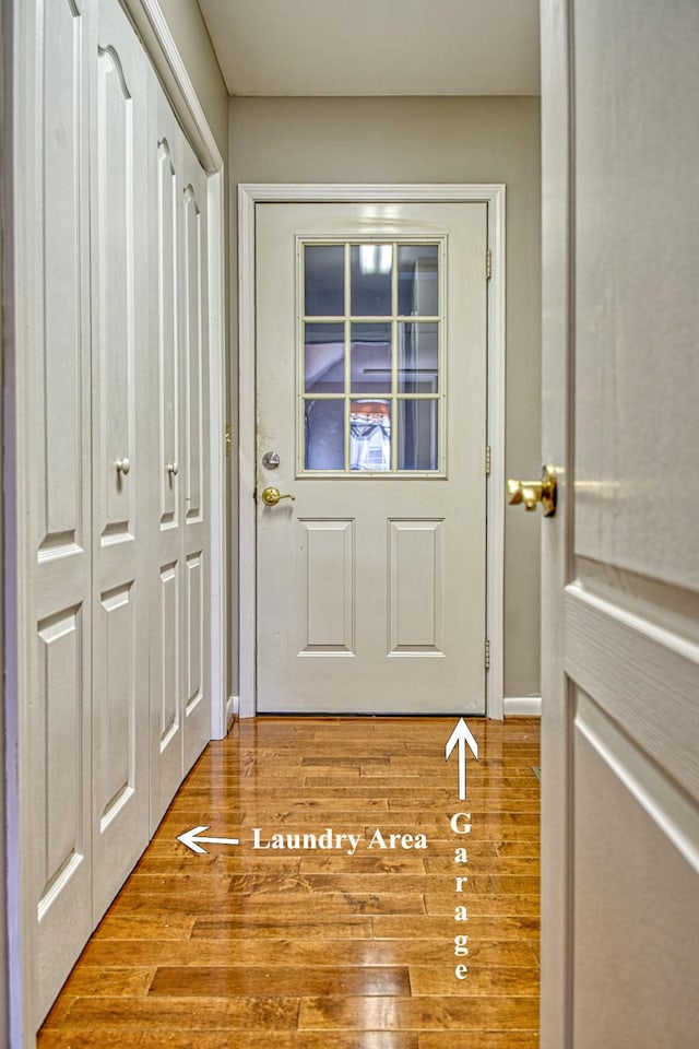 doorway featuring wood finished floors