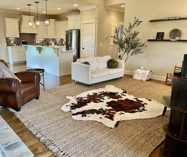 832 Brook Trl, Lebanon, TN 37087 - living area featuring light wood finished floors, ornamental molding, and recessed lighting