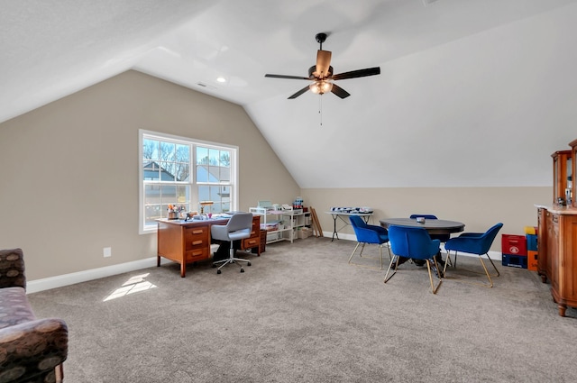 office with vaulted ceiling, carpet, baseboards, visible vents, and a ceiling fan