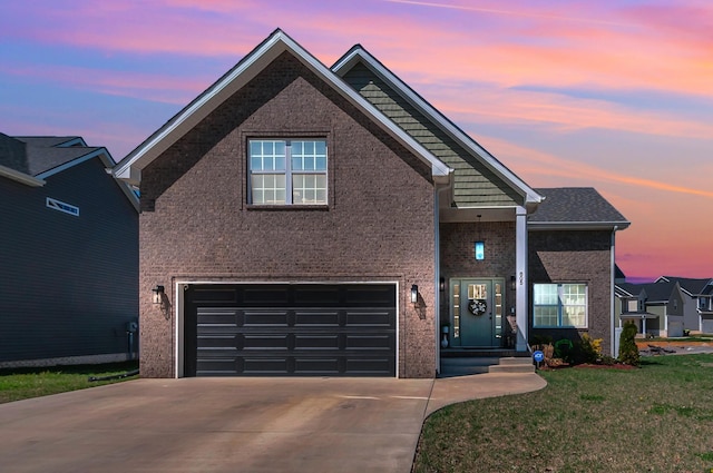 traditional home featuring brick siding, concrete driveway, a garage, and a front lawn