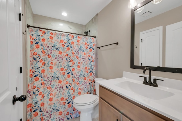 bathroom with toilet, vanity, a shower with shower curtain, and visible vents