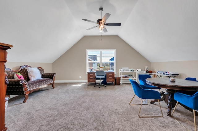 home office featuring carpet flooring, a ceiling fan, baseboards, and vaulted ceiling