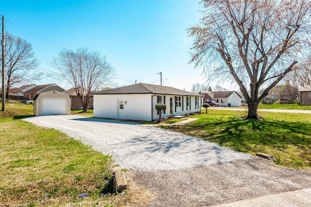 ranch-style home with an outdoor structure, gravel driveway, a front yard, and stucco siding