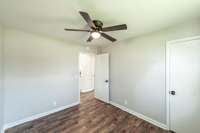 unfurnished bedroom with baseboards, ceiling fan, and dark wood-style flooring