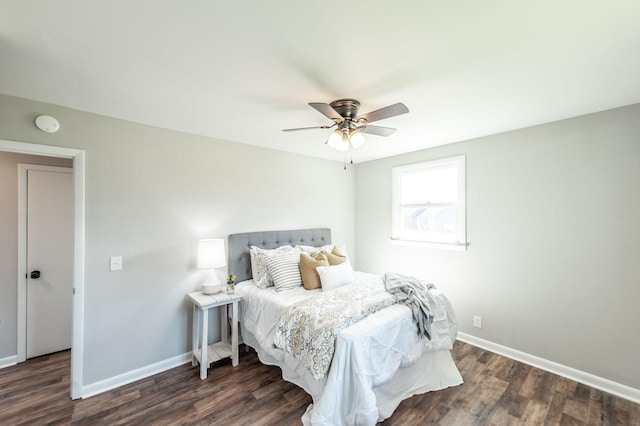 bedroom with baseboards, ceiling fan, and wood finished floors