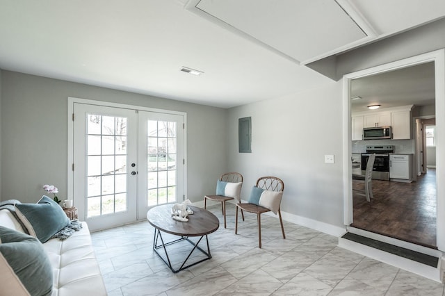 living area with french doors, marble finish floor, baseboards, and visible vents