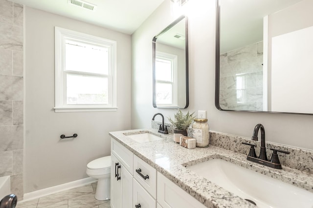 bathroom with marble finish floor, baseboards, visible vents, and a sink