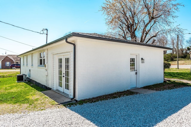 view of outbuilding with central air condition unit and french doors