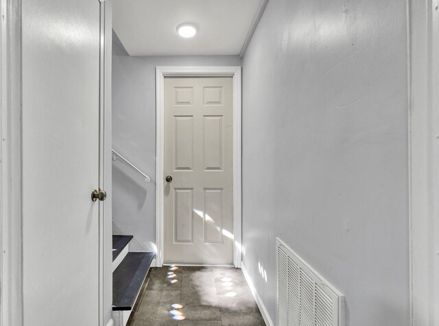 interior space with baseboards and visible vents