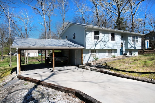 exterior space with a carport and concrete driveway