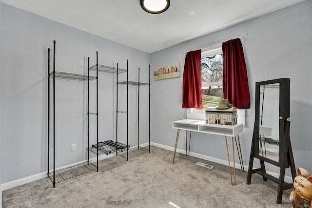 bedroom with baseboards, visible vents, and carpet floors
