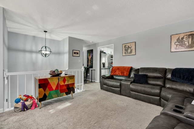 carpeted living area featuring a textured ceiling and a chandelier