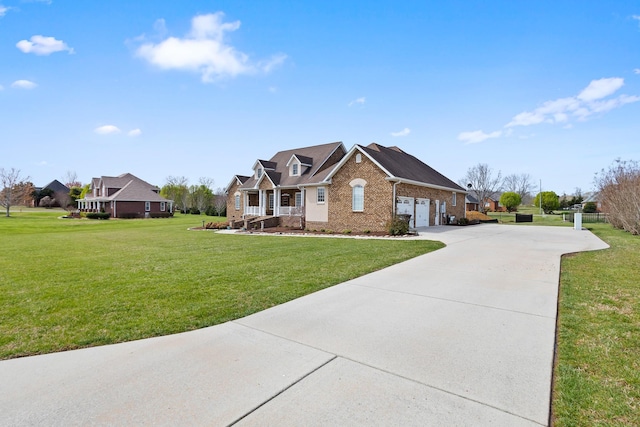 view of front of house with a front yard, a garage, brick siding, and concrete driveway