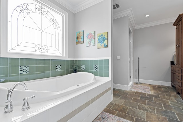 bathroom with baseboards, visible vents, ornamental molding, and a bath