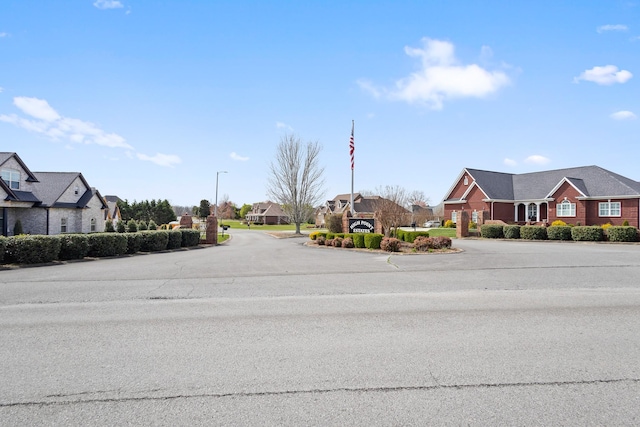 view of road featuring a residential view and street lighting