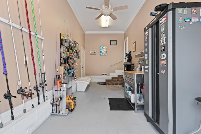 interior space featuring concrete flooring, ornamental molding, and ceiling fan