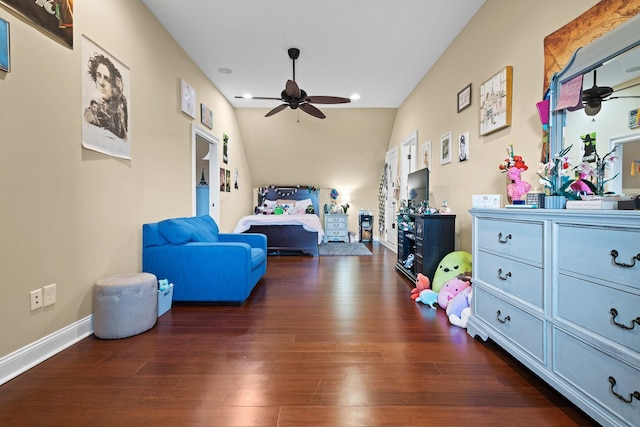 bedroom featuring baseboards and dark wood finished floors