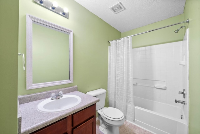 bathroom featuring a textured ceiling, visible vents, toilet, tile patterned floors, and vanity