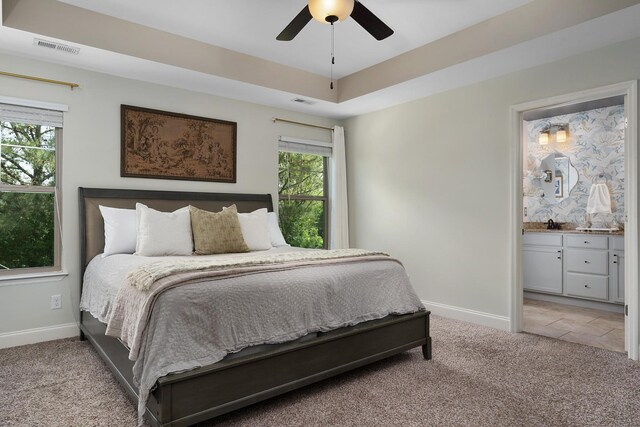 157 Battle Bluff Dr, Rossville, GA 30741 - carpeted bedroom featuring a raised ceiling, baseboards, multiple windows, and visible vents