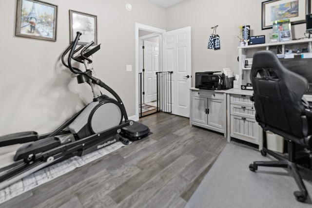 office area featuring baseboards and dark wood-style flooring