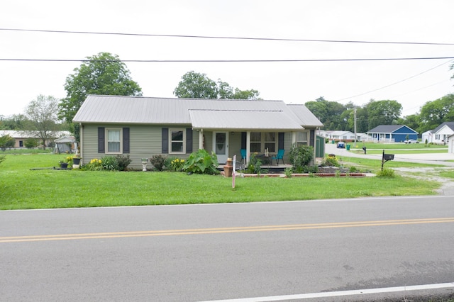 96 Liberty Rd, Winchester, TN 37398 - view of front of home featuring a porch, a front lawn, and a metal roof