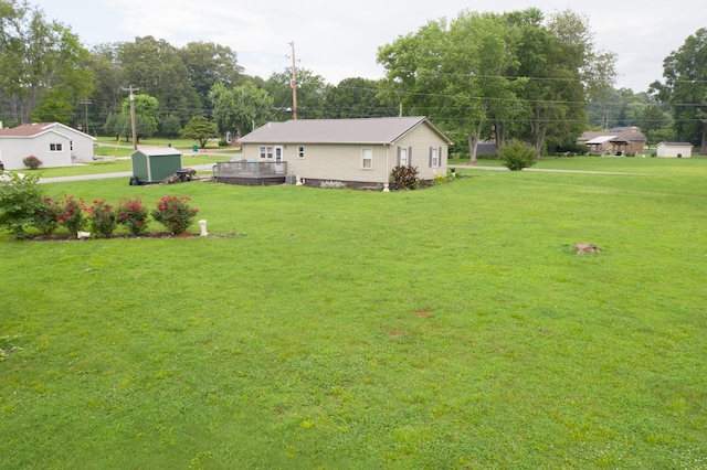 96 Liberty Rd, Winchester, TN 37398 - view of green lawn with a shed and a deck