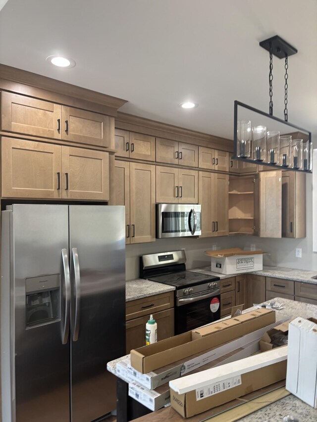 kitchen with light stone counters, recessed lighting, open shelves, decorative light fixtures, and stainless steel appliances
