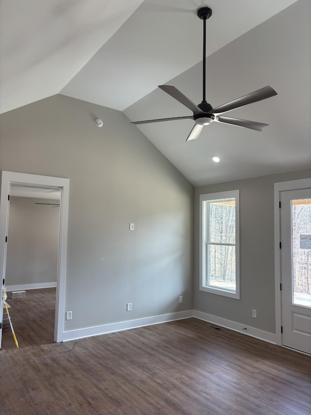 unfurnished living room with wood finished floors, baseboards, a ceiling fan, and vaulted ceiling