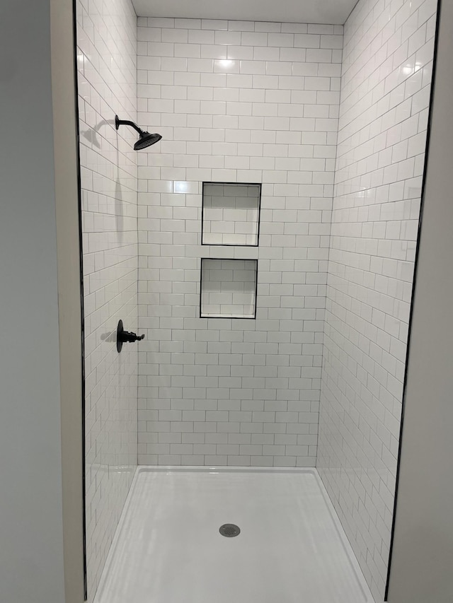 full bathroom featuring a stall shower