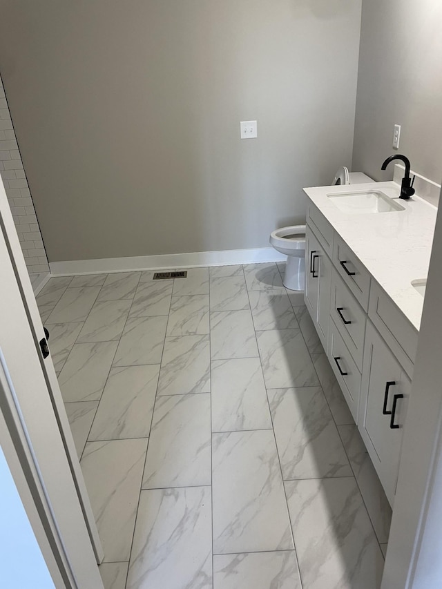 full bathroom with visible vents, marble finish floor, a sink, double vanity, and baseboards