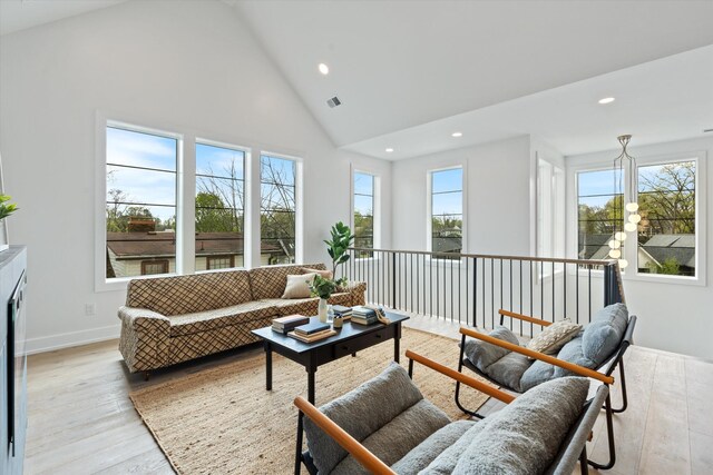 2510 Vaulx Ln, Nashville, TN 37204 - living room featuring a wealth of natural light, recessed lighting, high vaulted ceiling, and light wood-style flooring