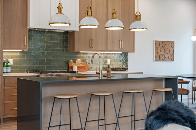 2510 Vaulx Ln, Nashville, TN 37204 - kitchen featuring a sink, backsplash, and a breakfast bar