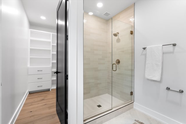 2510 Vaulx Ln, Nashville, TN 37204 - full bathroom with a spacious closet, visible vents, baseboards, and a stall shower