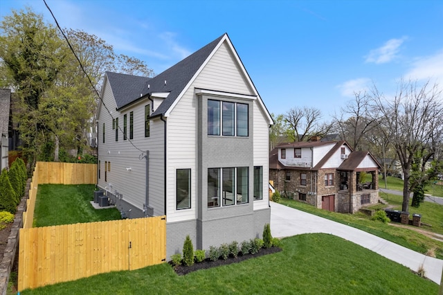 2510 Vaulx Ln, Nashville, TN 37204 - exterior space with central AC unit, a yard, and fence