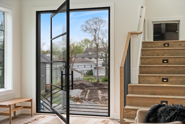 2510 Vaulx Ln, Nashville, TN 37204 - doorway featuring baseboards, plenty of natural light, and stairs