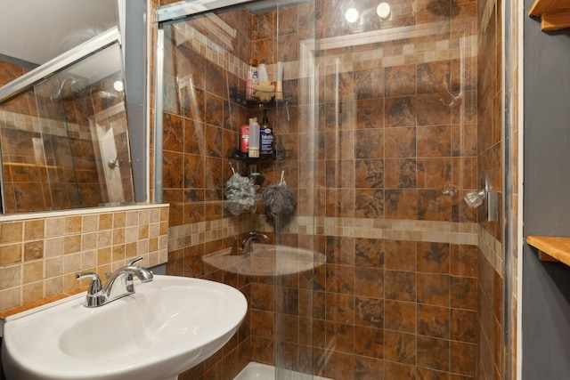 4825 Peppertree Dr, Antioch, TN 37013 - full bath featuring tile walls, a sink, and a stall shower
