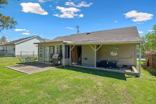4825 Peppertree Dr, Antioch, TN 37013 - rear view of house featuring a lawn, central AC unit, fence, and a patio area