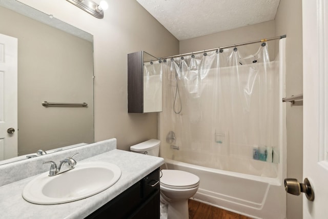 4825 Peppertree Dr, Antioch, TN 37013 - full bathroom featuring vanity, toilet, a textured ceiling, shower / bath combination with curtain, and wood finished floors