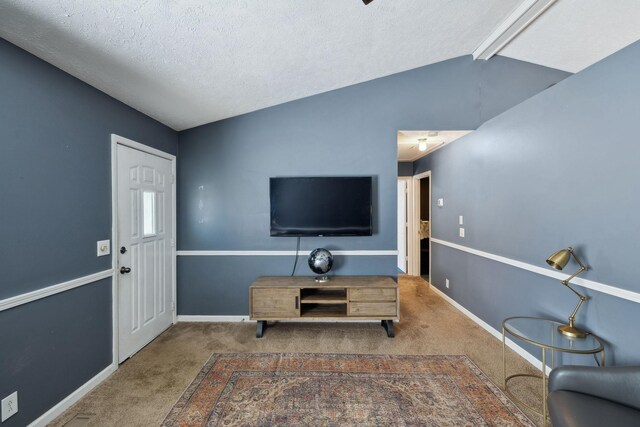 4825 Peppertree Dr, Antioch, TN 37013 - carpeted living area with baseboards, a textured ceiling, and vaulted ceiling with beams