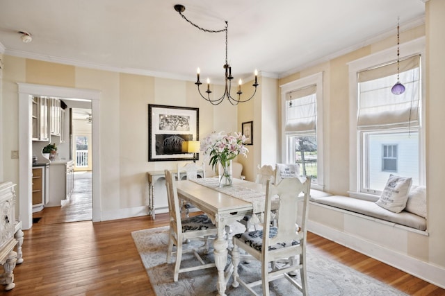 3617 Meadowbrook Ave, Nashville, TN 37205 - dining room with ornamental molding, a notable chandelier, wood finished floors, and a healthy amount of sunlight