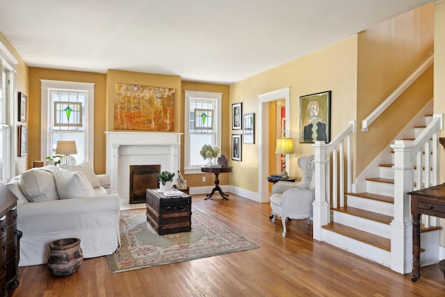 3617 Meadowbrook Ave, Nashville, TN 37205 - living room featuring baseboards, stairs, a brick fireplace, and wood finished floors