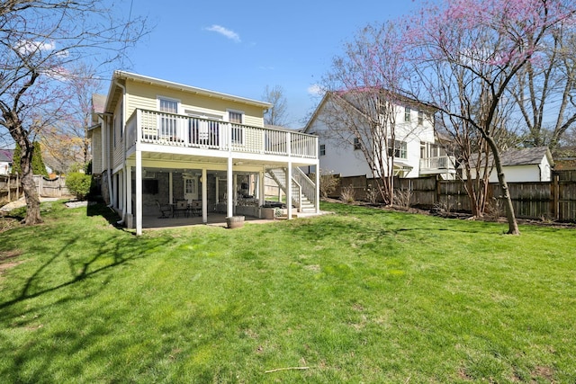 3617 Meadowbrook Ave, Nashville, TN 37205 - rear view of house with stairs, a wooden deck, a fenced backyard, a lawn, and a patio